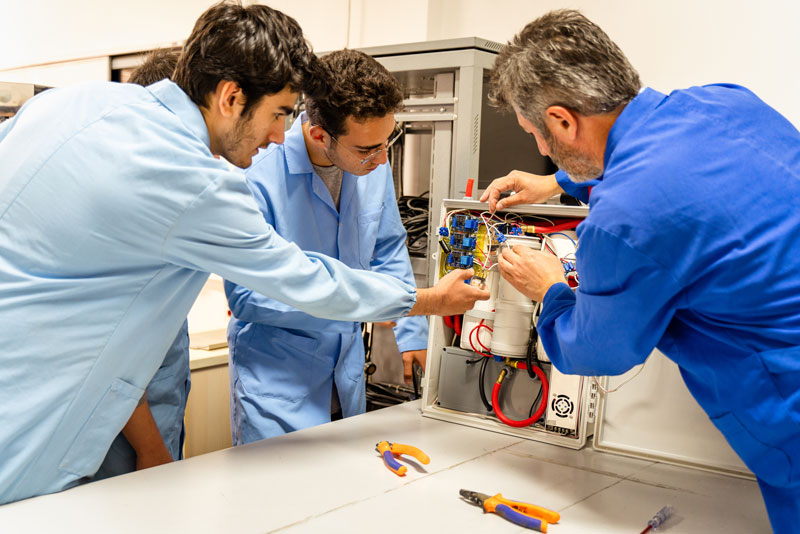 Students collaborating on electronics project